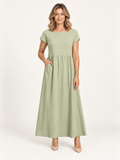 Zaragoza – vestido verde, portada de catálogo premium con modelo rubia